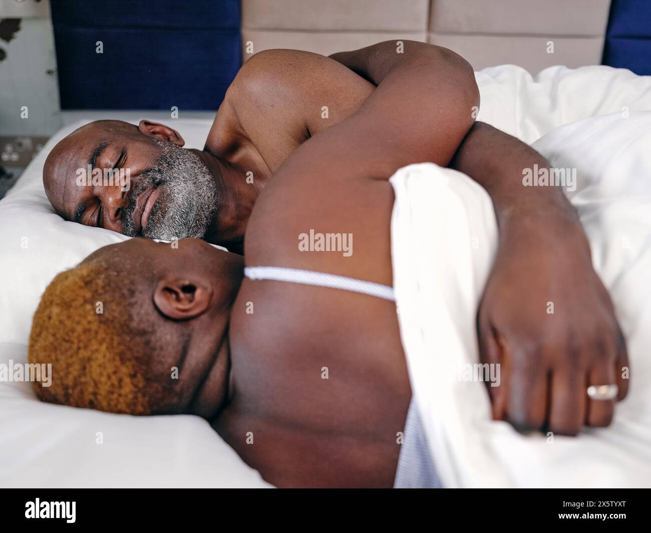 UK, Mature couple sleeping in bed Stock Photo