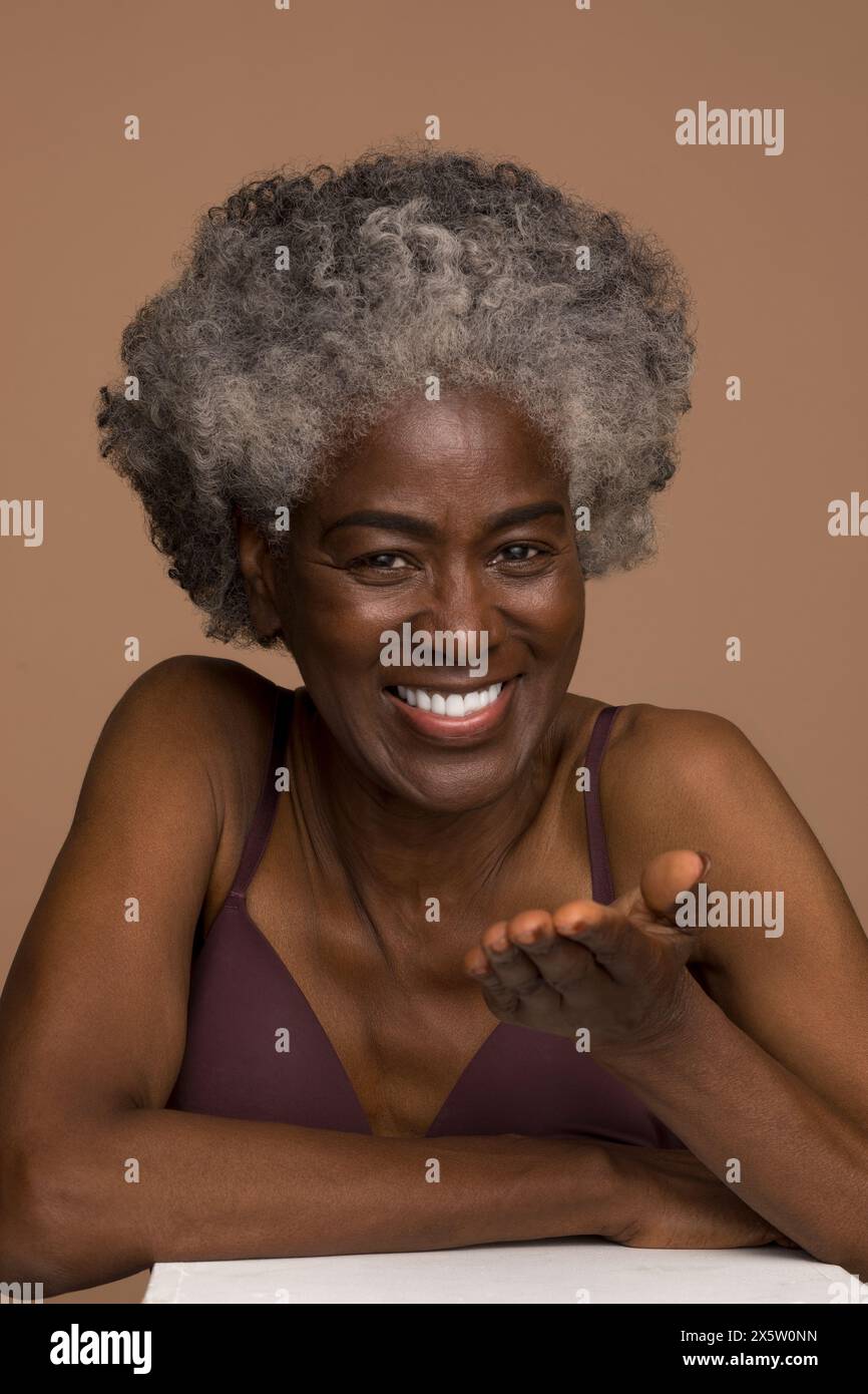 Cheerful senior woman gesturing hi-res stock photography and images - Alamy