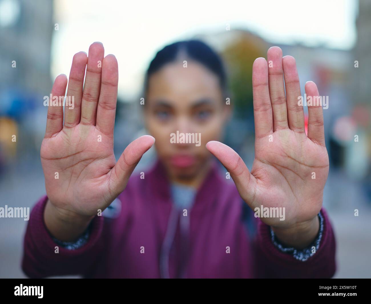 Young woman showing palms of hands Stock Photo