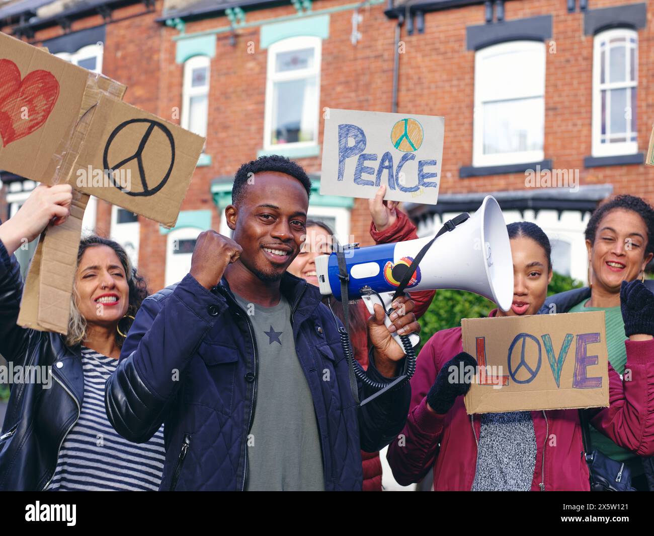 People on street holding protest signs with symbols of peace Stock ...