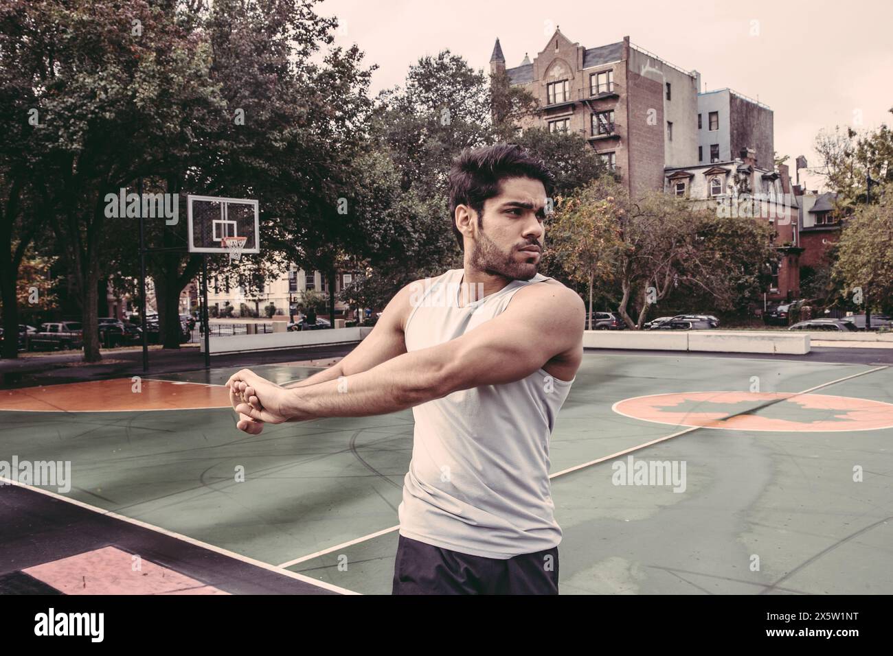 Muscular young man stretching hi-res stock photography and images - Alamy