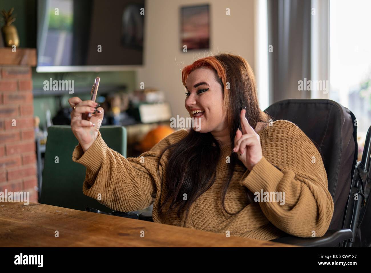 Woman in wheelchair taking selfie Stock Photo - Alamy