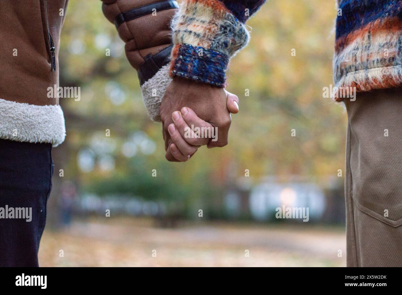 Gay couple holding hands up close hi-res stock photography and images ...