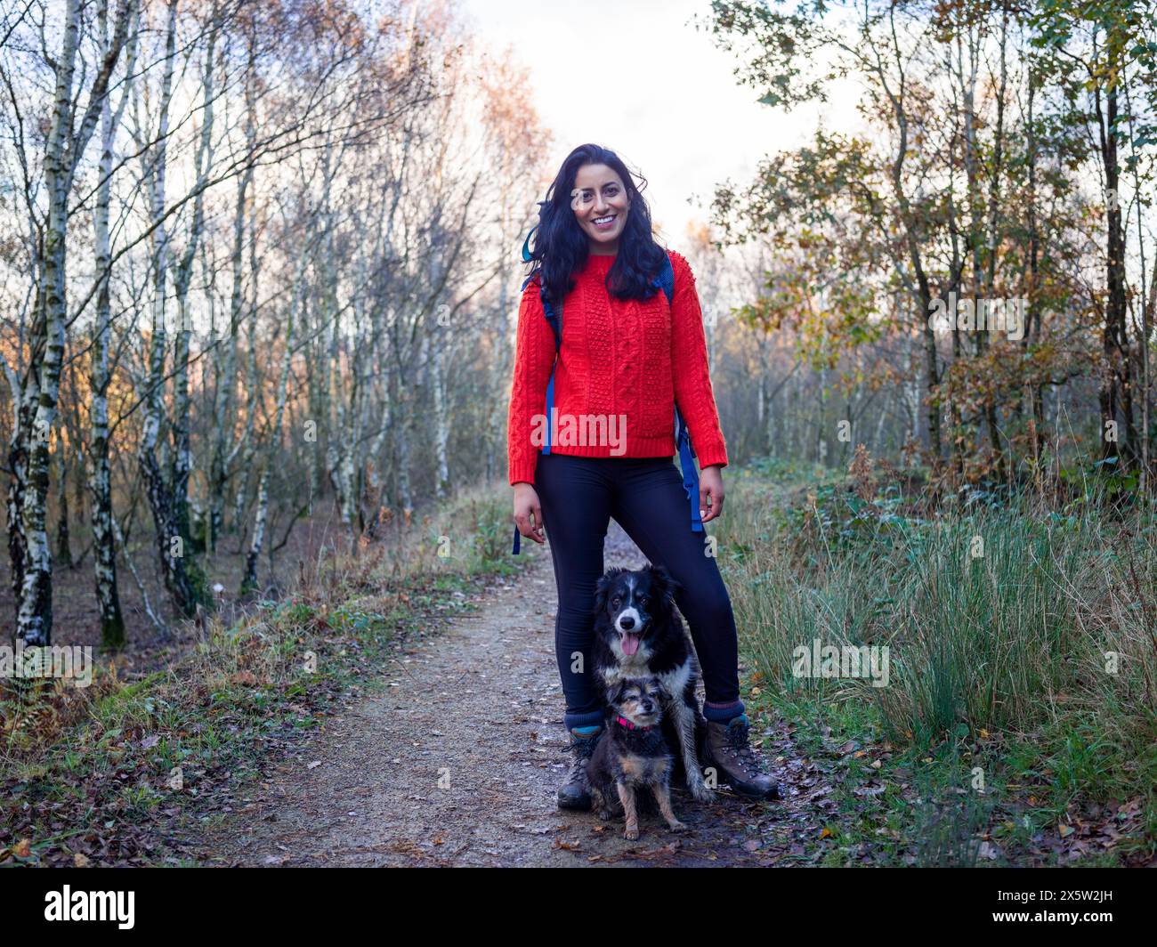 Woman and dogs hiking hi-res stock photography and images - Alamy