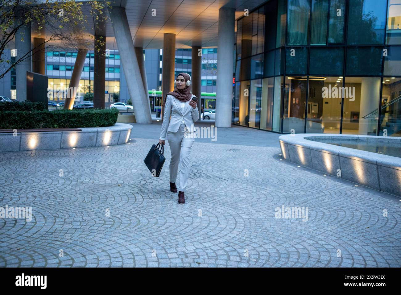 Business woman in hijab walking hi-res stock photography and images - Alamy