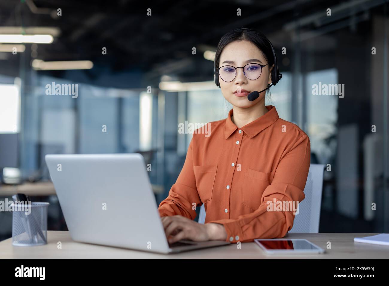 Focused young asian woman headset hi-res stock photography and images ...