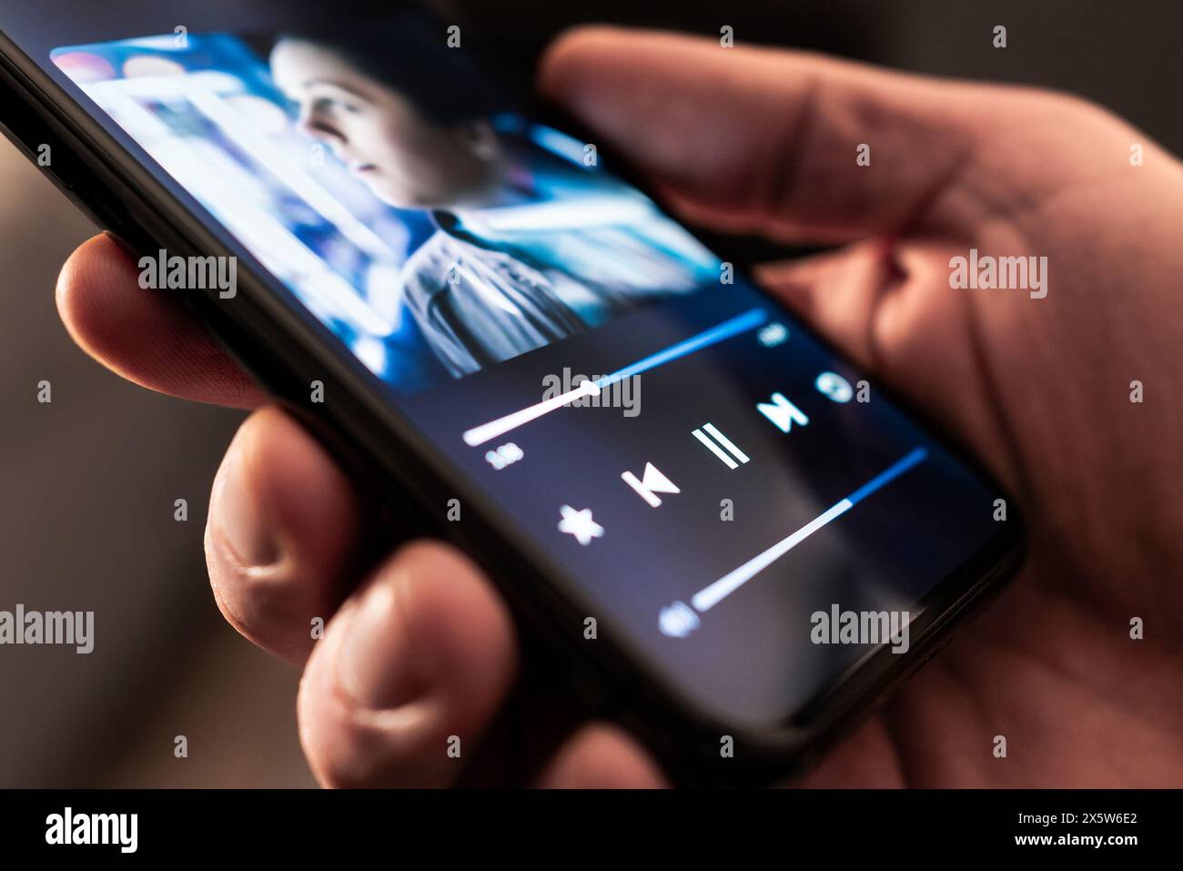 Music in phone. Stream playlist app. Song or podcast mobile player. Listen to audio record or book with smartphone. Mockup interface. Stock Photo