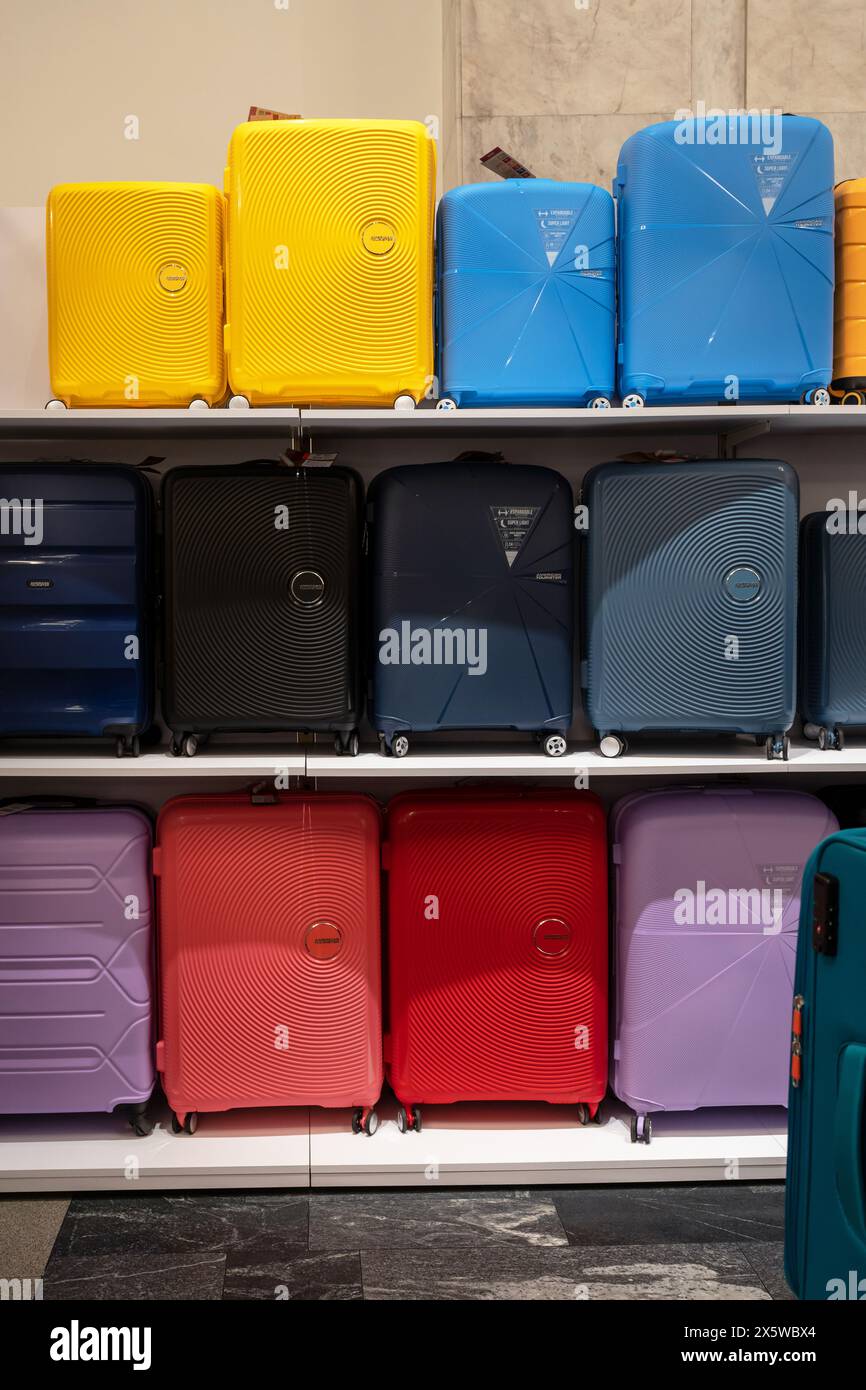 Large selection of travel suitcases for sale at the mall. Trolley