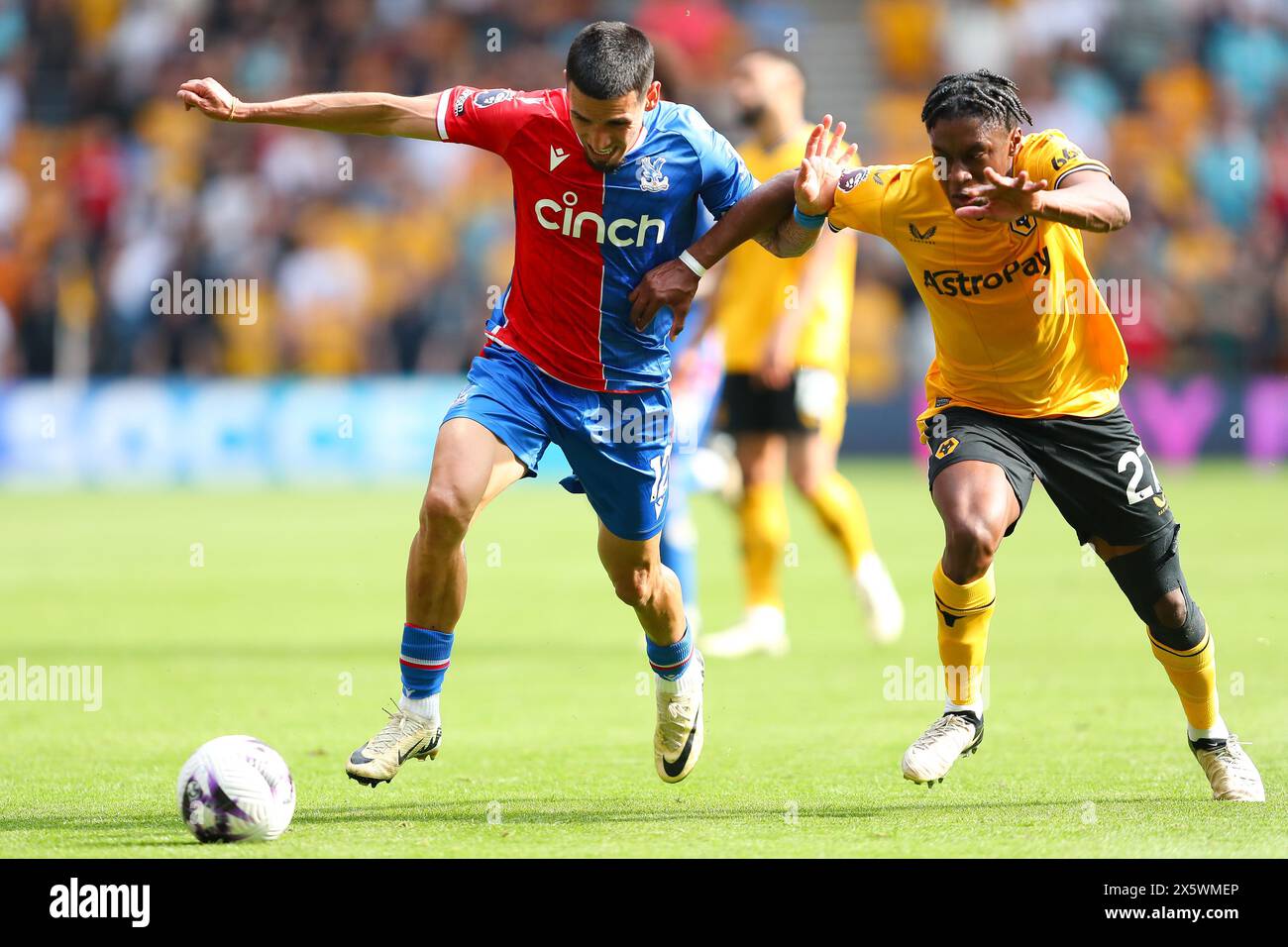 Daniel Mu-oz of Crystal Palace and Jean-Ricner Bellegarde of Wolves in action during the Premier League match between Wolverhampton Wanderers and Crystal Palace at Molineux, Wolverhampton on Saturday 11th May 2024. (Photo: Gustavo Pantano | MI News) Credit: MI News & Sport /Alamy Live News Stock Photo