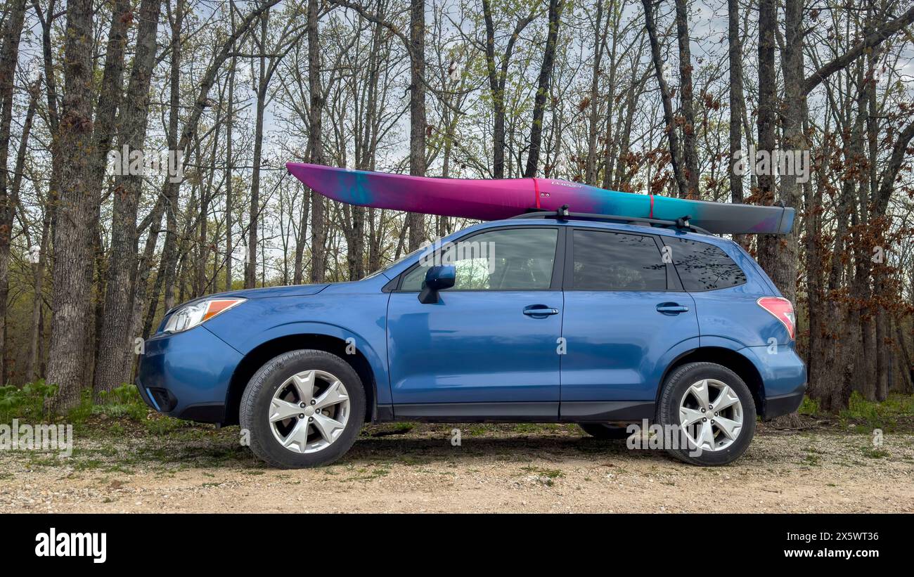 Rosebud, MO, USA April 20, 2024 Dagger kayak on roof racks of Subaru