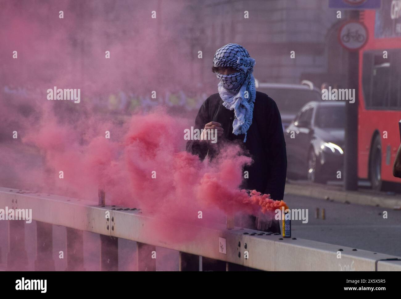 London, UK. 11th May 2024. Pro-Palestine protesters set off smoke flares and block Waterloo Bridge as Israel continues its attacks on Gaza. Credit: Vuk Valcic/Alamy Live News Stock Photo