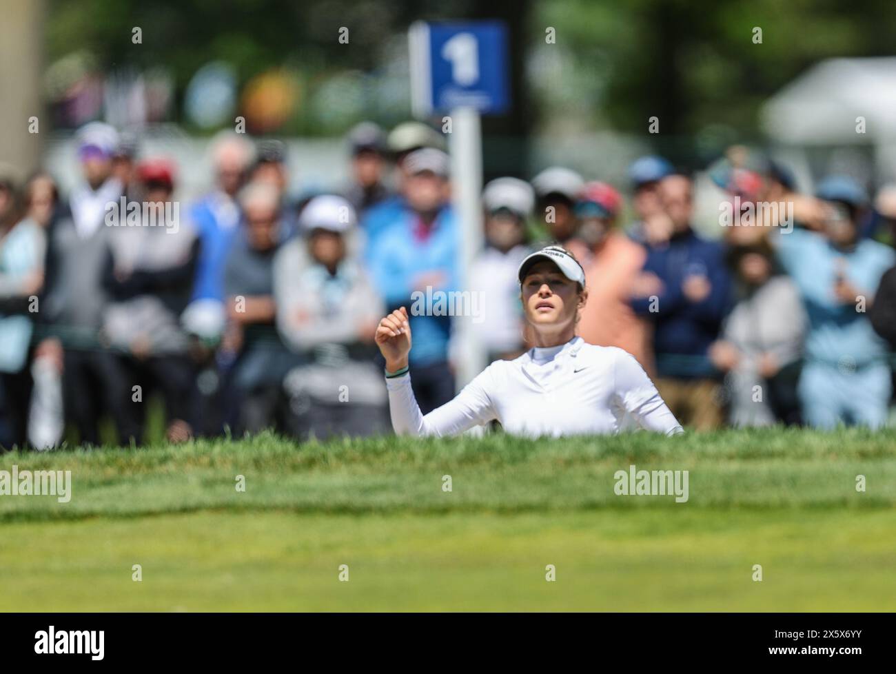 Clifton, NJ, USA. 11th May, 2024. Nelly Korda of the United States jumps up from the bunker at the first tee to see where her shot landed during the third round at the Cognizant Founders Cup at the Upper Montclair Country Club in Clifton, NJ. Mike Langish/CSM (Credit Image: © Mike Langish/Cal Sport Media) (Credit Image: © Mike Langish/Cal Sport Media). Credit: csm/Alamy Live News Stock Photo