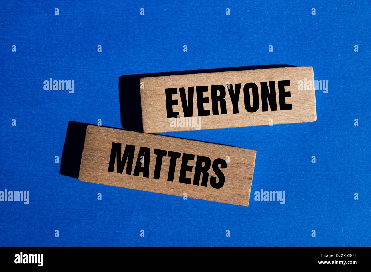 Everyone matters words written on wooden blocks with blue background. Conceptual everyone matters symbol. Copy space. Stock Photo