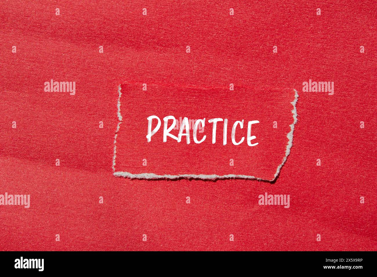 Practice word written on ripped red paper with red background ...