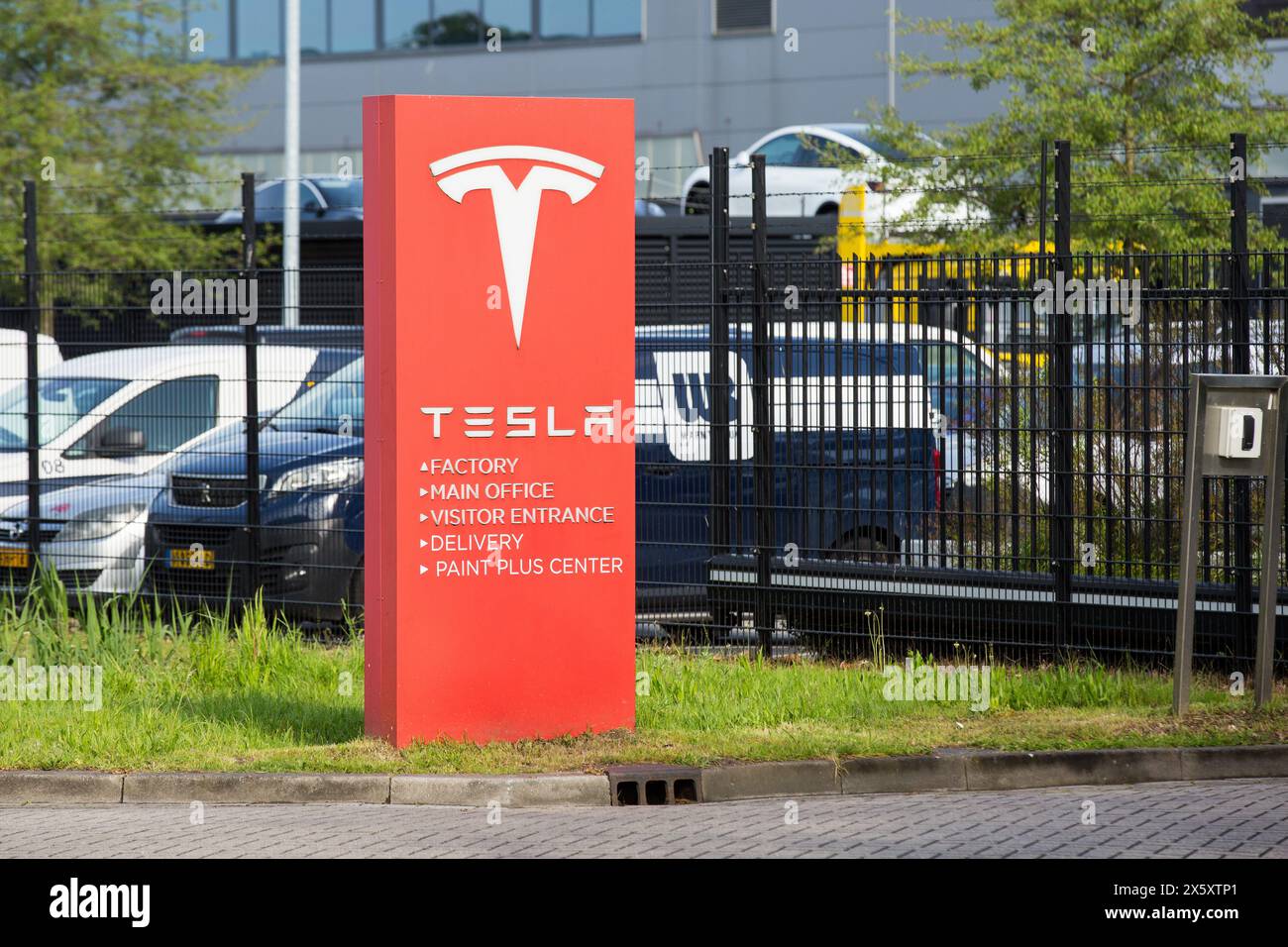Tilburg, Netherlands. 1st May, 2024. An American automotive and energy company that specialises in electric car manufacturing; Tesla, signboard seen in Tilburg. Tesla, has several factory buildings in the industrial zone of Vossenberg in Tilburg. Tilburg Factory & Delivery Center is next to the Wilhelmina Canal allowing for water-based delivery of intermodal. (Credit Image: © Karol Serewis/SOPA Images via ZUMA Press Wire) EDITORIAL USAGE ONLY! Not for Commercial USAGE! Stock Photo