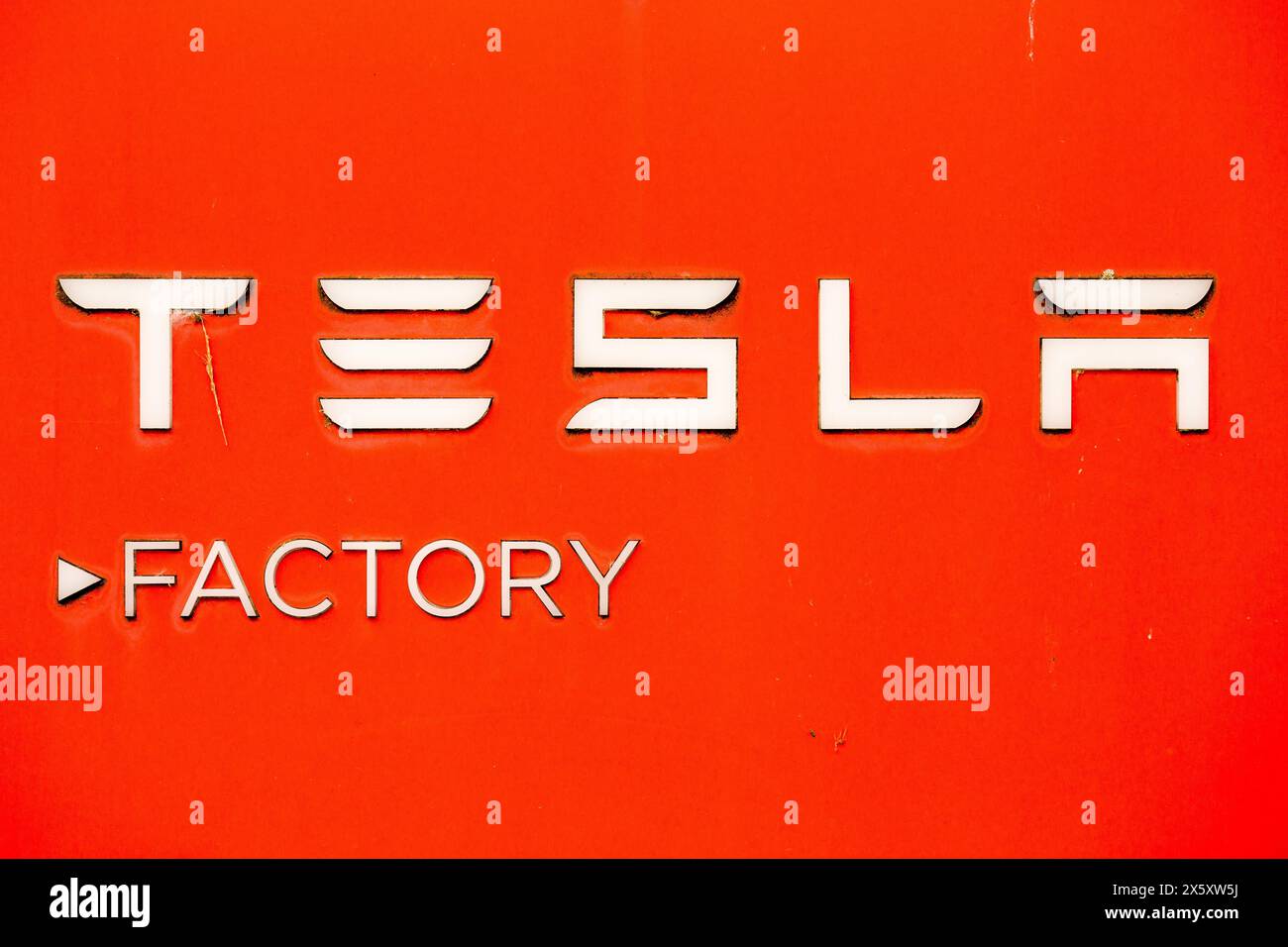 Tilburg, Netherlands. 1st May, 2024. An American automotive and energy company that specialises in electric car manufacturing; Tesla inscription on signboard seen in Tilburg. Tesla, has several factory buildings in the industrial zone of Vossenberg in Tilburg. Tilburg Factory & Delivery Center is next to the Wilhelmina Canal allowing for water-based delivery of intermodal. (Credit Image: © Karol Serewis/SOPA Images via ZUMA Press Wire) EDITORIAL USAGE ONLY! Not for Commercial USAGE! Stock Photo