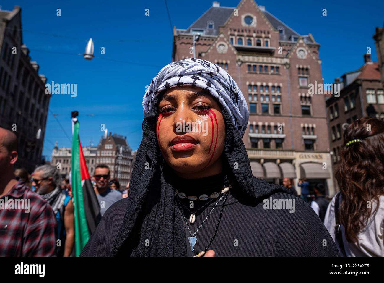 Amsterdam, North Holland, Netherlands. 11th May, 2024. A pro-Palestinian demonstrator has bloody tears painted on their face. On May 11, 2024, several thousand pro-Palestinian demonstrators gathered on Dam Square in Amsterdam. From Dam Square, the demonstrators marched to Museumplein, Amsterdam, for further speeches. The call of this demonstration demanded an end to the Nakba in Palestine, the Israeli occupation, and the Dutch government's support of the Israeli government. Credit: ZUMA Press, Inc./Alamy Live News Stock Photo