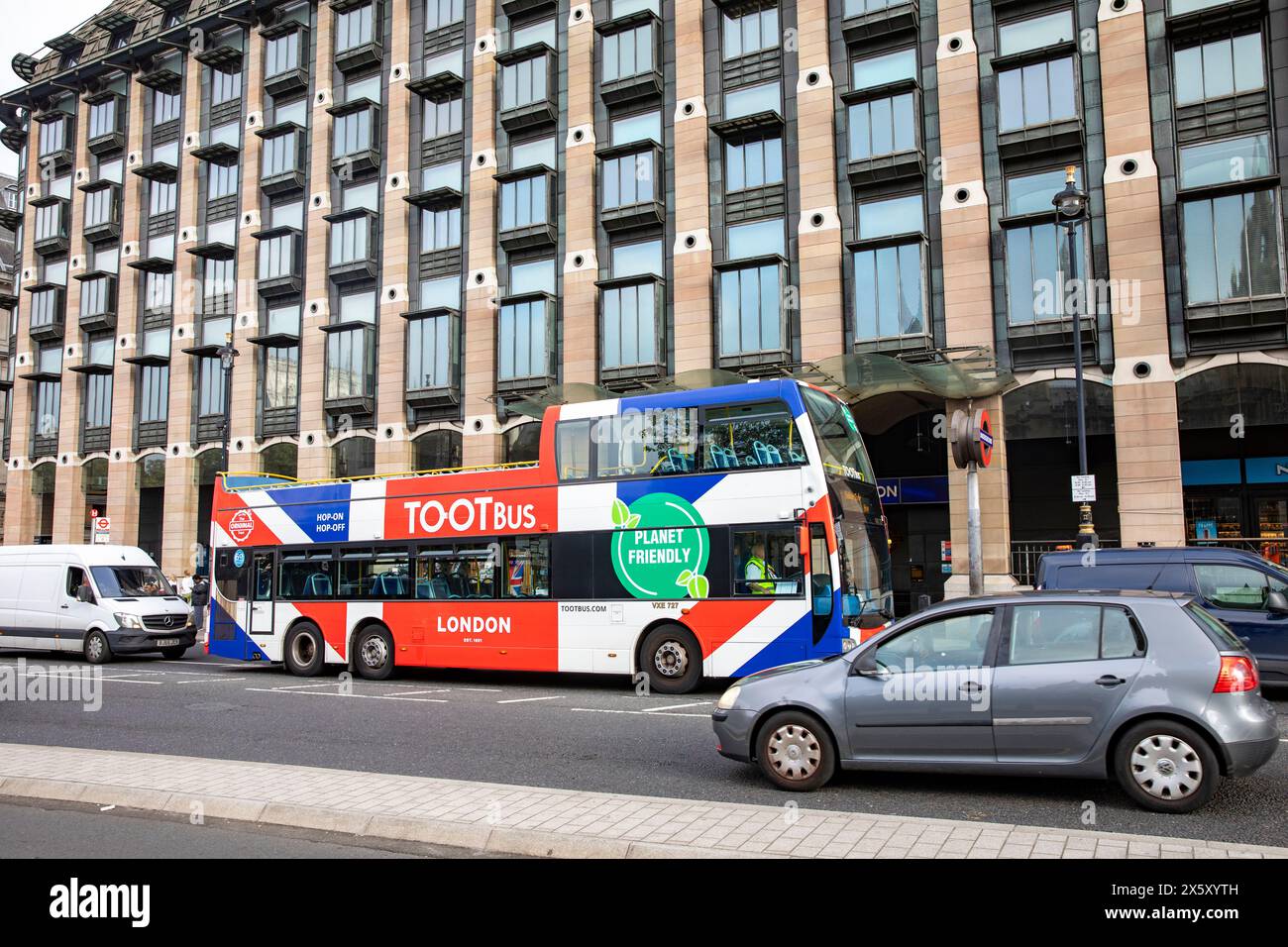 Westminster London, London Toot sightseeing tour bus, double decker in Union Jack livery, outside New Parliamentary building,England,UK,2023 Stock Photo