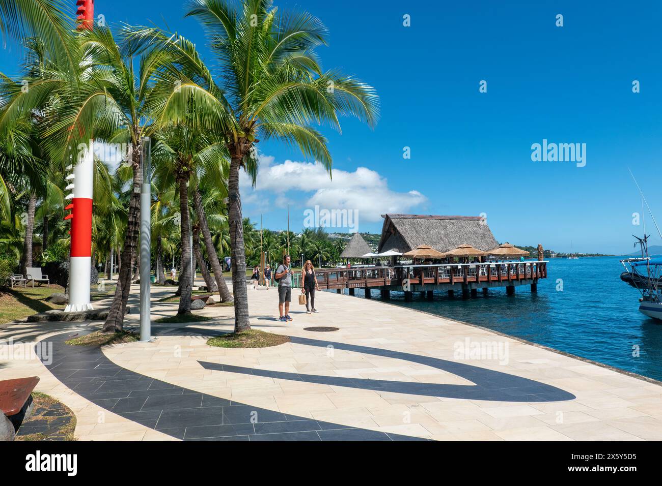 Tourists strolling on the waterfront at Papeete, Island of Tahiti, French Polynesia Stock Photo