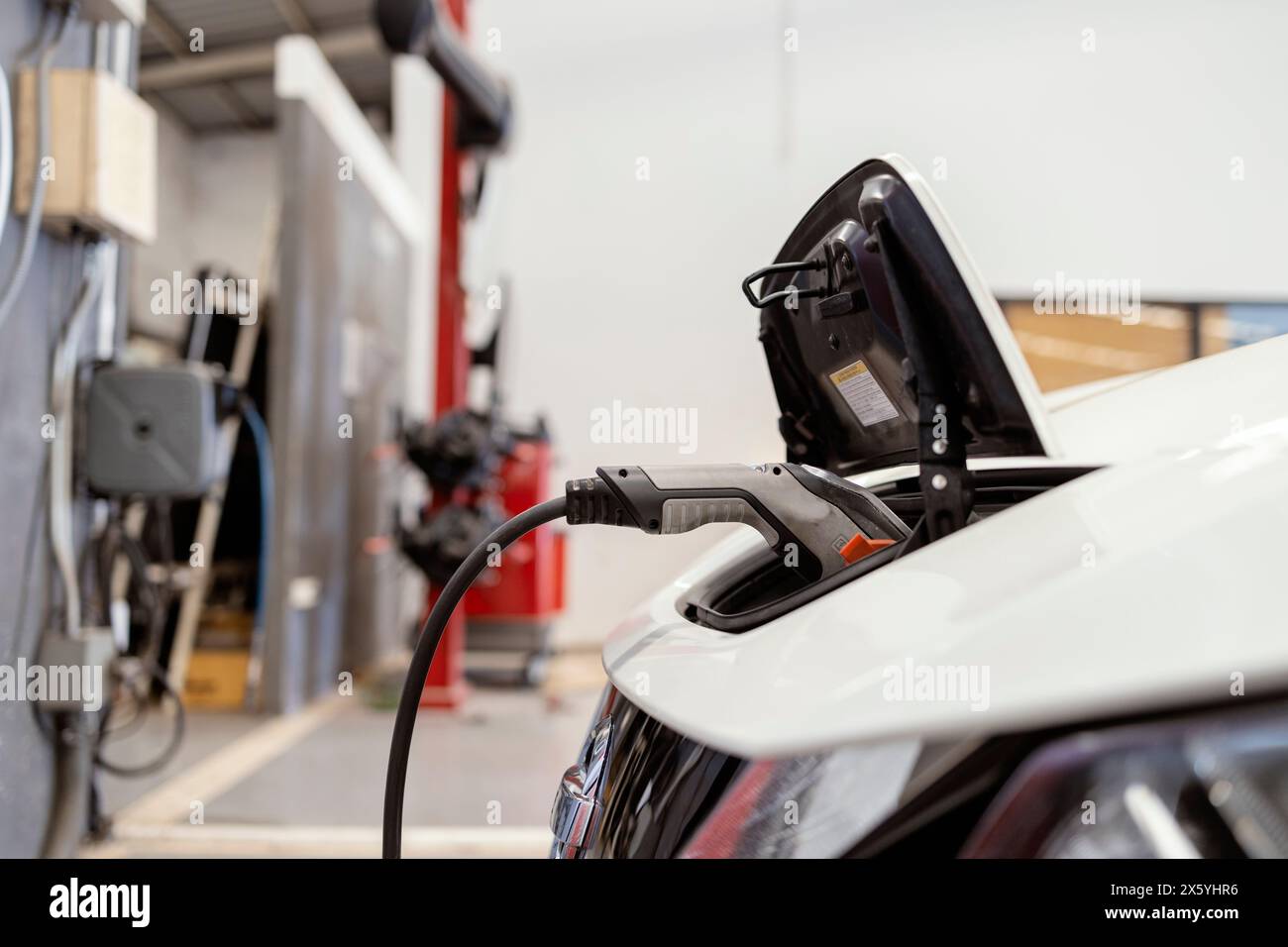 Eco-Friendly Mobility: EV Charging Station for Electric Vehicles, Green Energy for Sustainable Future Stock Photo