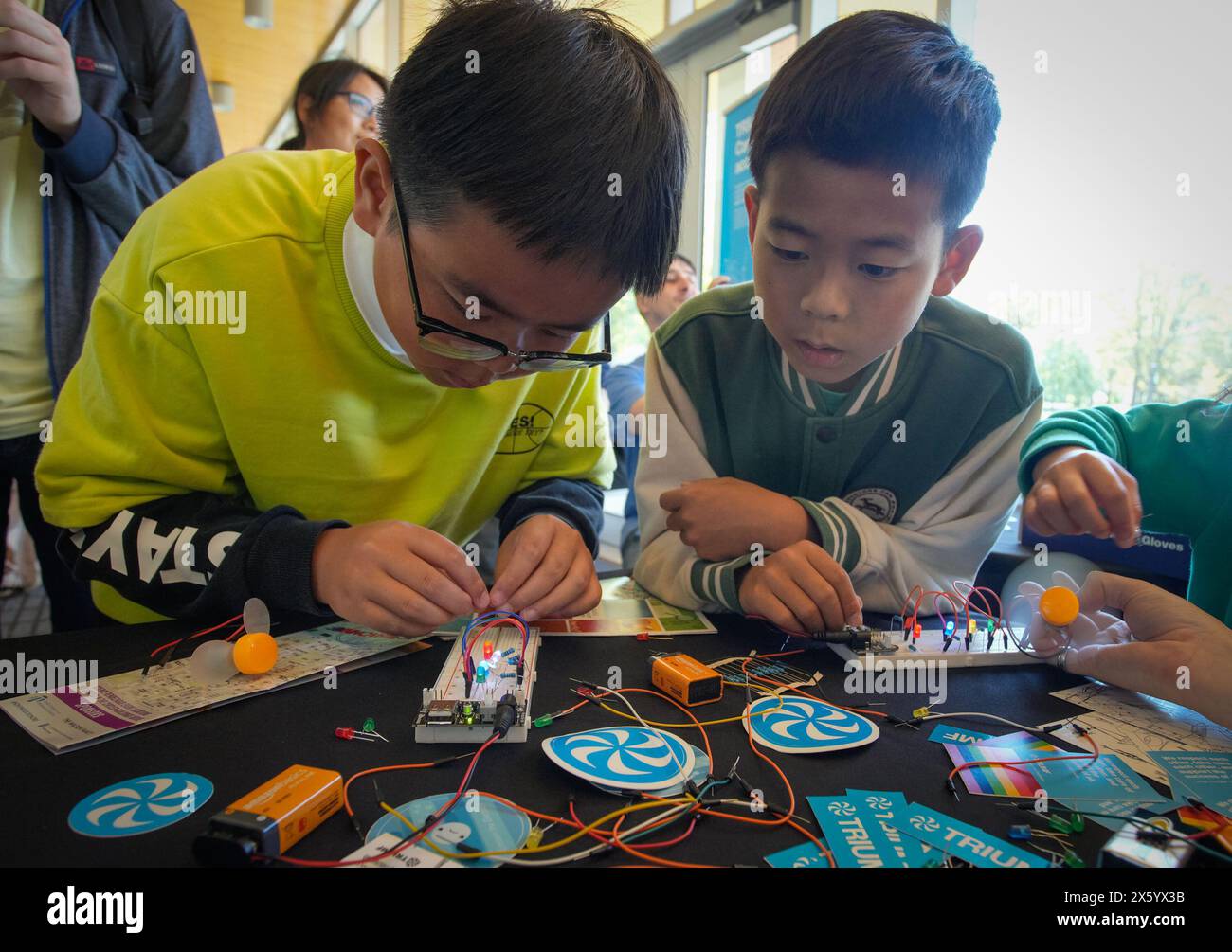 Vancouver, Canada. 11th May, 2024. Children learn to build an electric circuit during the Science Rendezvous event at the University of British Columbia (UBC) in Vancouver, British Columbia, Canada, on May 11, 2024. The Science Rendezvous is an annual festival held across Canada, offering hands-on activities and demonstrations to foster curiosity and public engagement in Science, Technology, Engineering, Arts, and Mathematics (STEAM). Credit: Liang Sen/Xinhua/Alamy Live News Stock Photo