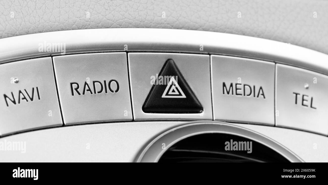 Media and navigation control buttons of a Modern car. Car interior details. White leather interior of the luxury modern car. Stock Photo