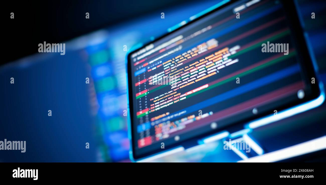 Work from home. Programmer coding code on notebook screen at Stock Photo