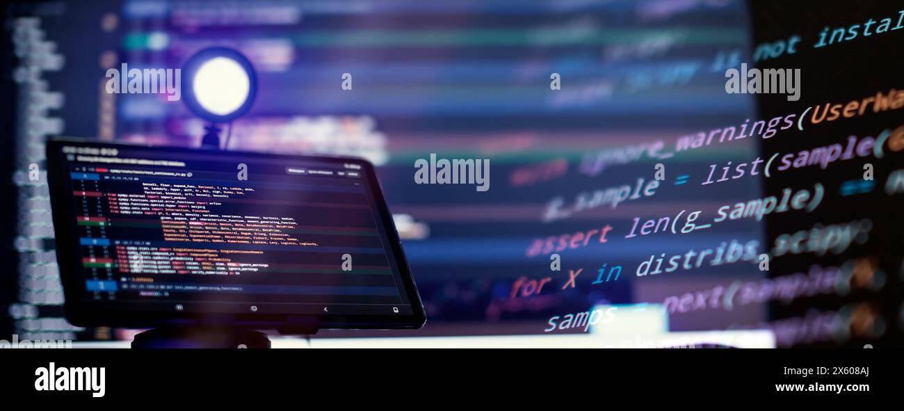 Work from home. Programmer coding code on notebook screen at Stock Photo