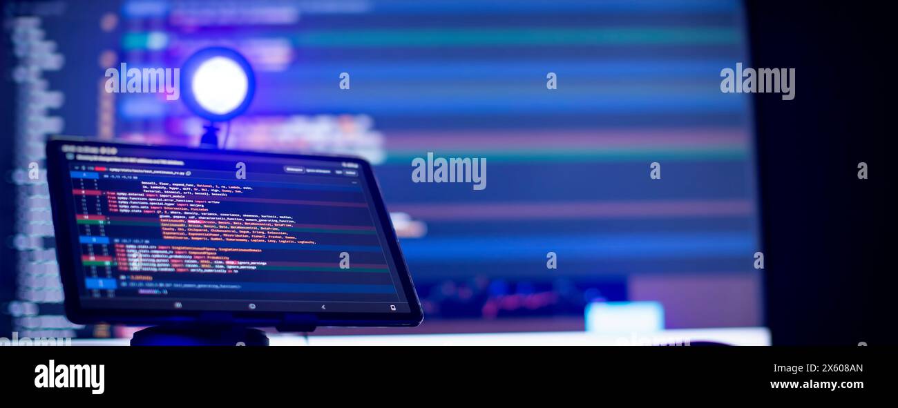 Work from home. Programmer coding code on notebook screen at Stock ...