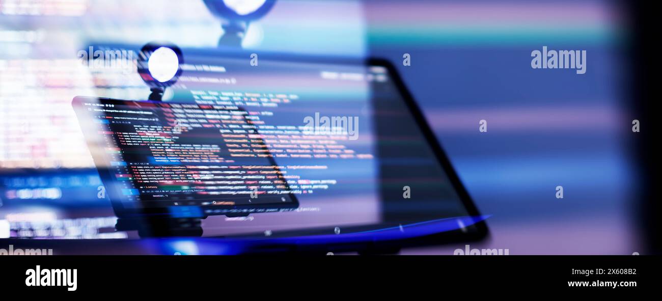 Work from home. Programmer coding code on notebook screen at Stock Photo