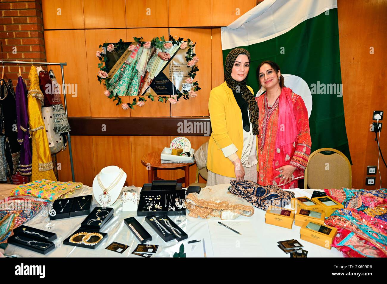Kensington Town Hall, LONDON, ENGLAND, UK - MAY 11 2024: Pakistan stall at The Young Diplomats in London (YDL) are presenting a charity event called 'Weaving International Fashion - National Dress Catwalk'. representing over 17 embassies in the, each reflecting its unique cultural heritage. The Young Diplomats in London Fashion Show got it right. In this era of immigration, every culture is proud of the tradition represented by its own men and women. People should think twice before choosing to emigrate. As an immigrant, we have given up our status and birthrights, but they have maintained the Stock Photo