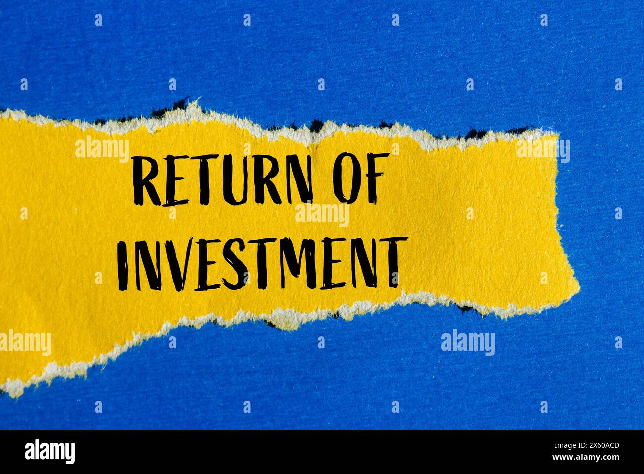 Return of investment words written on ripped yellow paper with blue background. Conceptual return of investment and business symbol. Copy space. Stock Photo