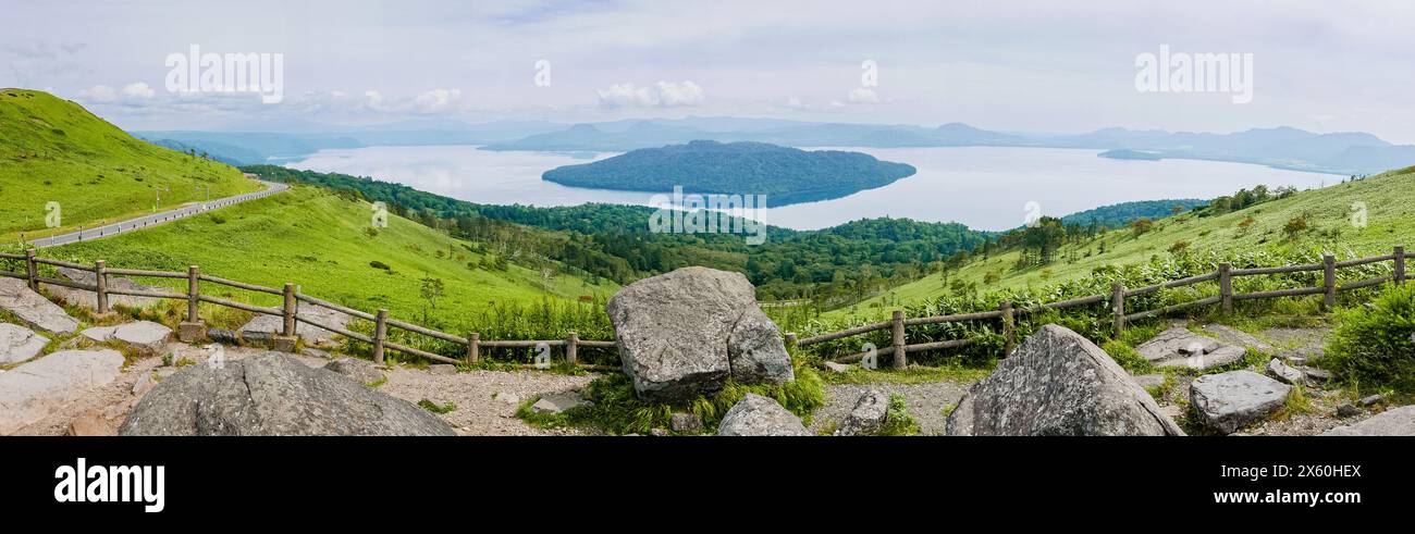 Panoramic view of Lake Kussharo, Japan's largest caldera lake, from the observation trail at Bihoro Pass in eastern Hokkaido on a late summer morning. Stock Photo