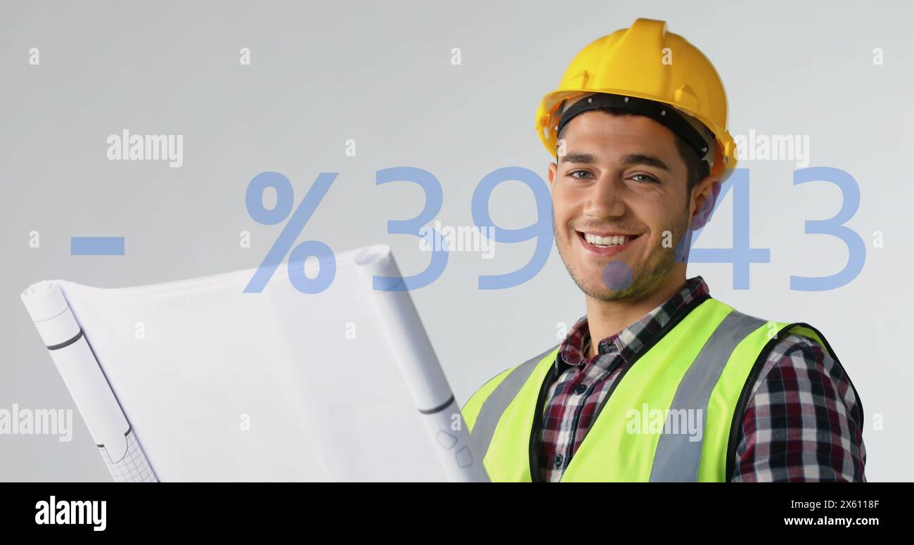 Image of plus, minus, percentile symbols, caucasian engineer wearing helmet looking at blueprint Stock Photo