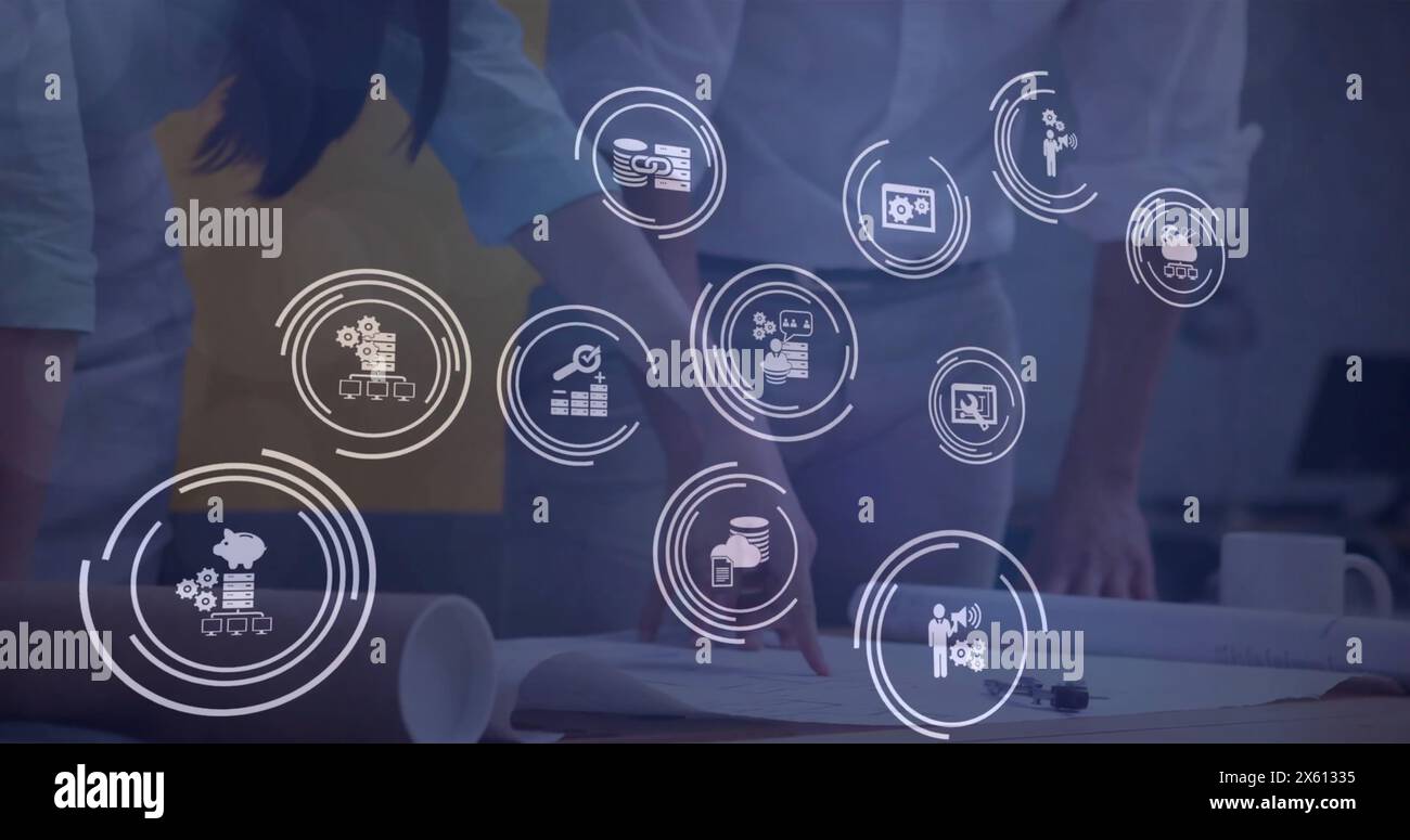 Image of icon in loading circles over caucasian engineers discussing ...