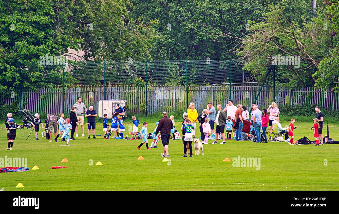 Glasgow, Scotland, UK. 12th May, 2024: UK Weather: Sunday sports  at  peterson park  for parents and children. Sunny for locals and tourists in the centre the city as temperatures rise to summer levels. Credit Gerard Ferry/Alamy Live News Stock Photo