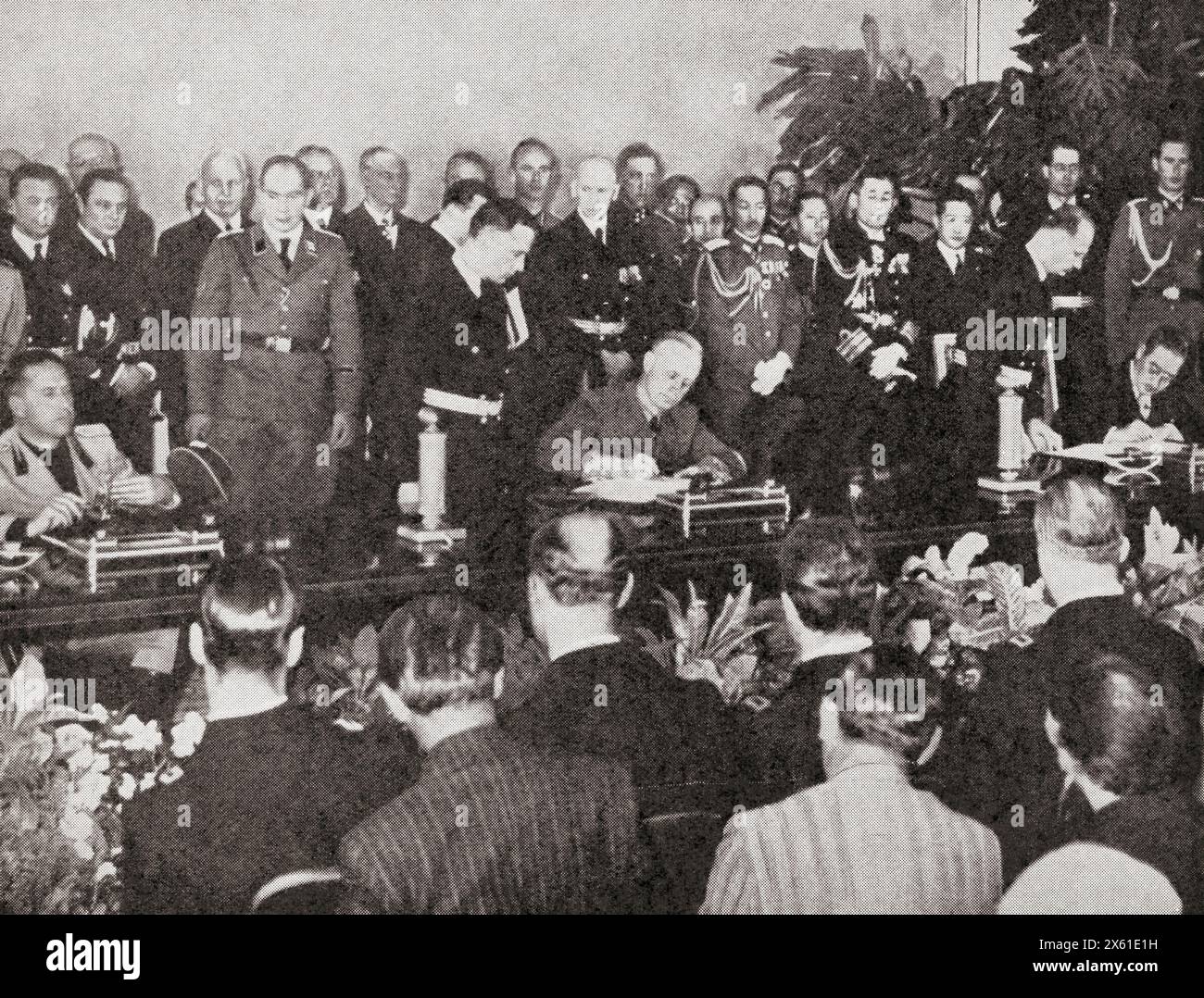 Japan signs the Tripartite Treaty, Berlin, 27 September 1940. Seen here seated from left to right, Ciano, Ribbentrop and Kuruso.  Gian Galeazzo Ciano, 2nd Count of Cortellazzo and Buccari , 1903 –1944. Italian diplomat, politician, Foreign Minister in the government of his father-in-law, Benito Mussolini.  Ulrich Friedrich-Wilhelm Joachim von Ribbentrop, 1893 – 1946. German politician, diplomat and Minister of Foreign Affairs of Nazi Germany.  Saburō Kurusu, 1886 – 1954. Japanese career diplomat and Imperial Japan's ambassador to Germany, 1939-1941.  From The War in Pictures, Sixth Y Stock Photo