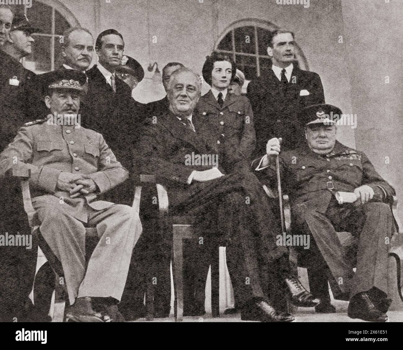 Stalin, Roosevelt and Churchill at the Teheran Conference, 1943. Sir Winston Leonard Spencer-Churchill, 1874 –1965. British politician, statesman, army officer, and writer, who was Prime Minister of the United Kingdom from 1940 to 1945 and again from 1951 to 1955.  Joseph Vissarionovich Dzhugashvili Stalin, 1878 –1953. Soviet communist revolutionary and politician. Franklin Delano Roosevelt, 1882 – 1945, aka FDR.  American statesman, political leader and 32nd president of the United States.  From The War in Pictures, Fifth Year. Stock Photo