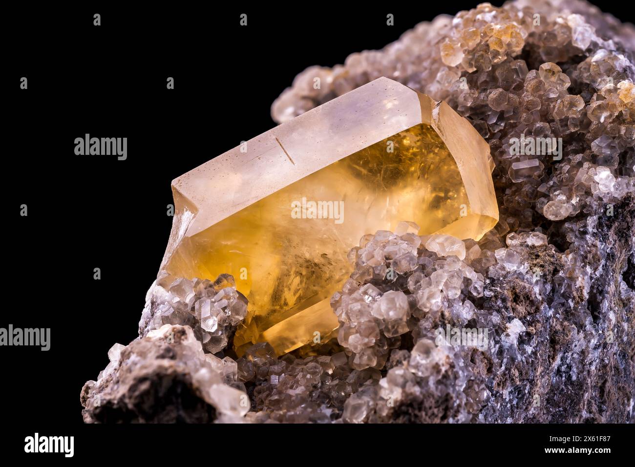 yellow calcite on matrix, From belgium. macro photography detail texture background. close-up raw rough unpolished semi-precious gemstone Stock Photo