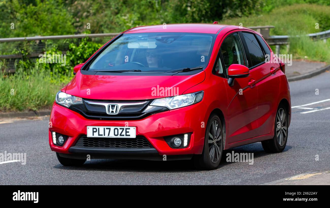 Milton Keynes,UK - May 11th 2024: 2017 red Honda Jazz  car driving on a British road Stock Photo