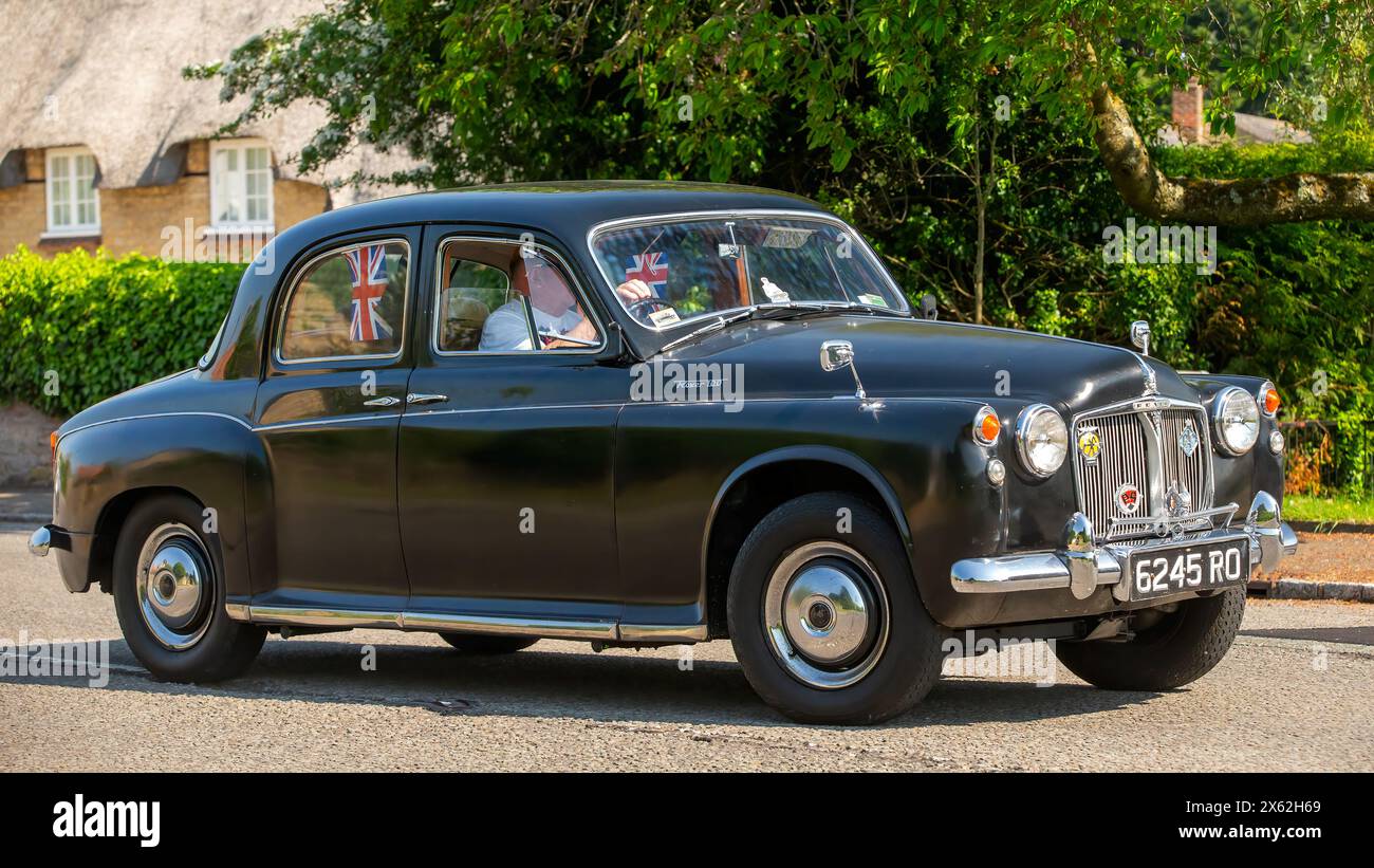 Stoke Goldington,UK - May 12th 2024:  1961 Rover 100 classic car driving on a British road Stock Photo