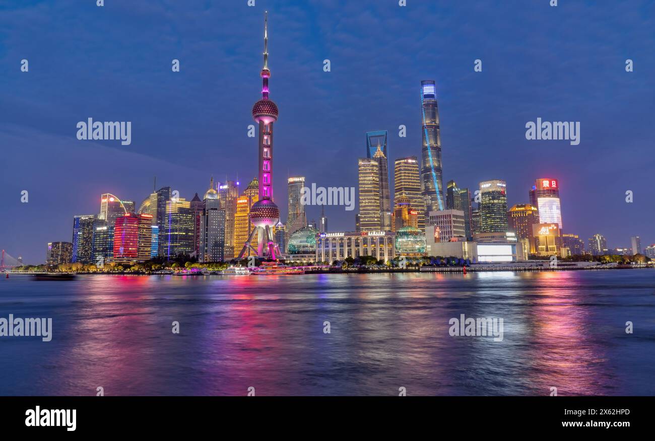 Shanghai, 8 April 2024: Shanghai skyline at Bund with Oriental Pearl Tower downtown panorama at night in China Stock Photo