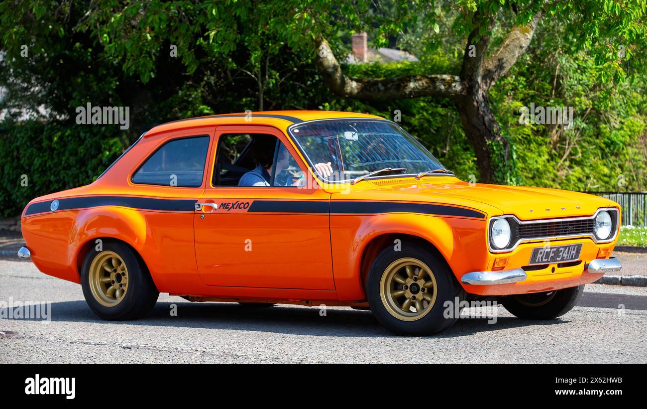 Milton Keynes,UK - May 5th 2024: 1970 orange Ford Escort mexico  classic car driving on a British road Stock Photo