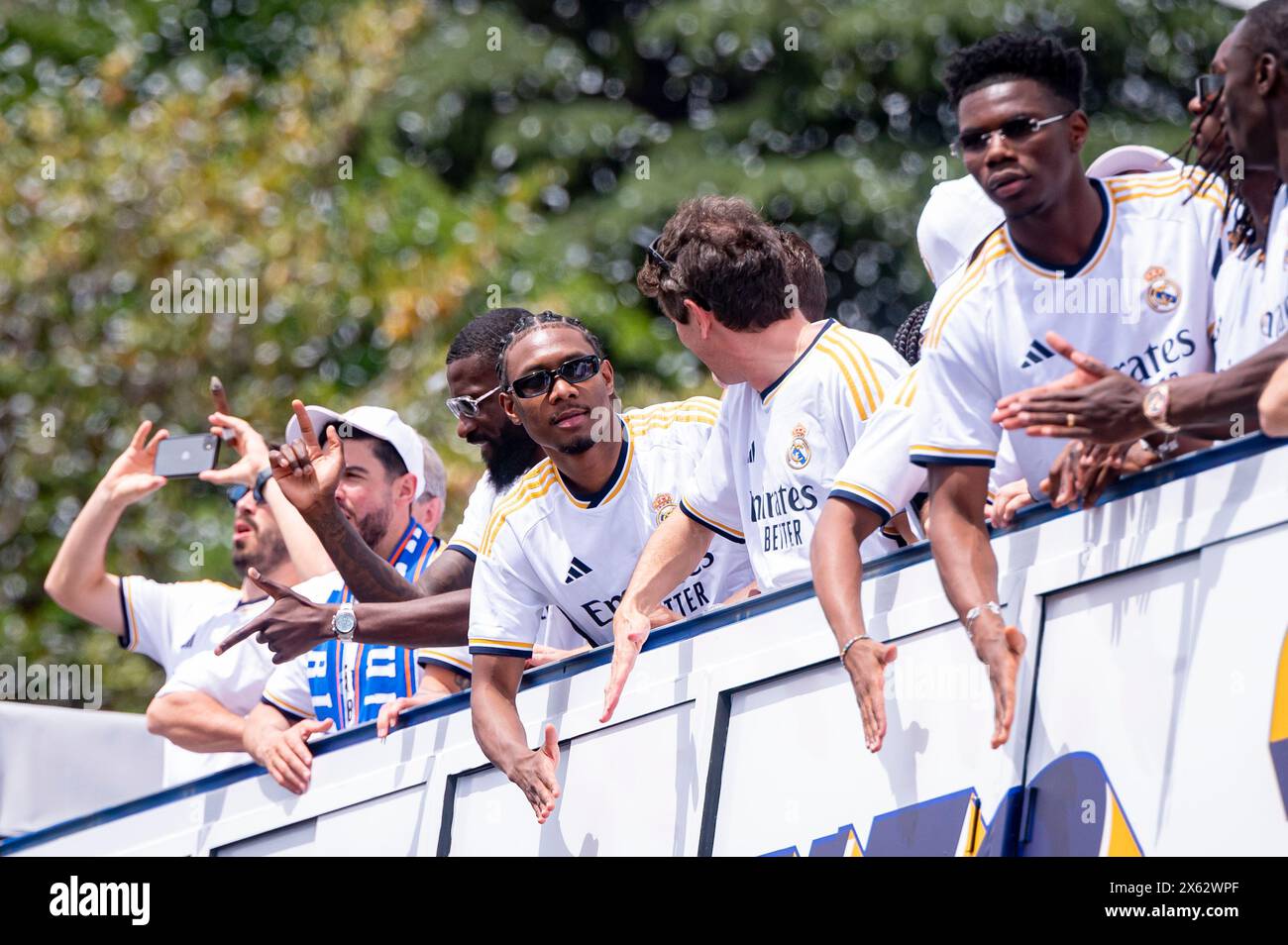 Madrid, Madrid, Spain. 12th May, 2024. MADRID, SPAIN - MAY 12: The open top bus with the Real Madrid players (from L to R) Antonio Rudiger, David Alaba, Aurelien Tchouameni seen arriving during the Real Madrid Celebration of The La Liga Title at Plaza de Cibeles on May 12, 2024 in Madrid, Spain. (Credit Image: © Alberto Gardin/ZUMA Press Wire) EDITORIAL USAGE ONLY! Not for Commercial USAGE! Credit: ZUMA Press, Inc./Alamy Live News Stock Photo