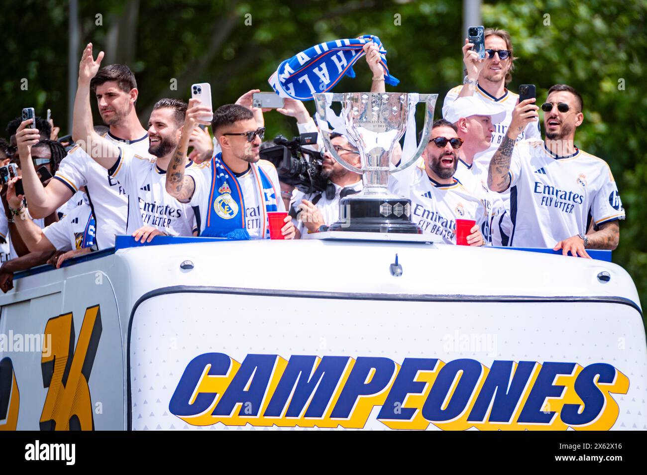 Madrid, Madrid, Spain. 12th May, 2024. MADRID, SPAIN - MAY 12: The open top bus with the Real Madrid players (from L to R) Nacho Fernandez, Thibaut Courtois, Dani Ceballos, Daniel Carvajal, Jose Luis Sanmartin Mato (Joselu), Luka Modric arrives at the Real Madrid Celebration of The La Liga Title at Plaza de Cibeles on May 12, 2024 in Madrid, Spain. (Credit Image: © Alberto Gardin/ZUMA Press Wire) EDITORIAL USAGE ONLY! Not for Commercial USAGE! Credit: ZUMA Press, Inc./Alamy Live News Stock Photo