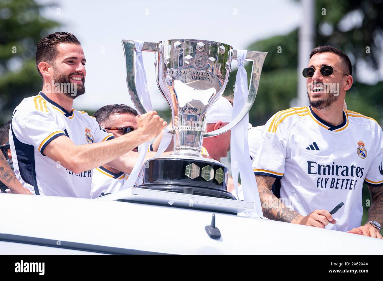 Madrid, Madrid, Spain. 12th May, 2024. MADRID, SPAIN - MAY 12: Real Madrid players (from L to R) Nacho Fernandez, Jose Luis Sanmartin Mato (Joselu) seen arriving with the open bus with La Liga trophy during the Real Madrid Celebration of The La Liga Title at Plaza de Cibeles on May 12, 2024 in Madrid, Spain. (Credit Image: © Alberto Gardin/ZUMA Press Wire) EDITORIAL USAGE ONLY! Not for Commercial USAGE! Credit: ZUMA Press, Inc./Alamy Live News Stock Photo