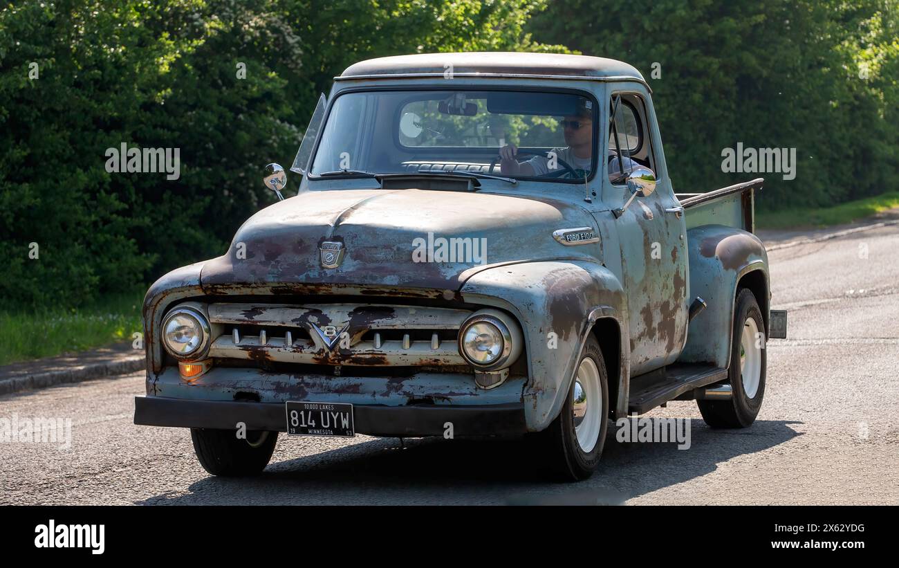 Stoke Goldington,UK - May 12th 2024: 1953 old Ford pick Up truck driving on a British road Stock Photo