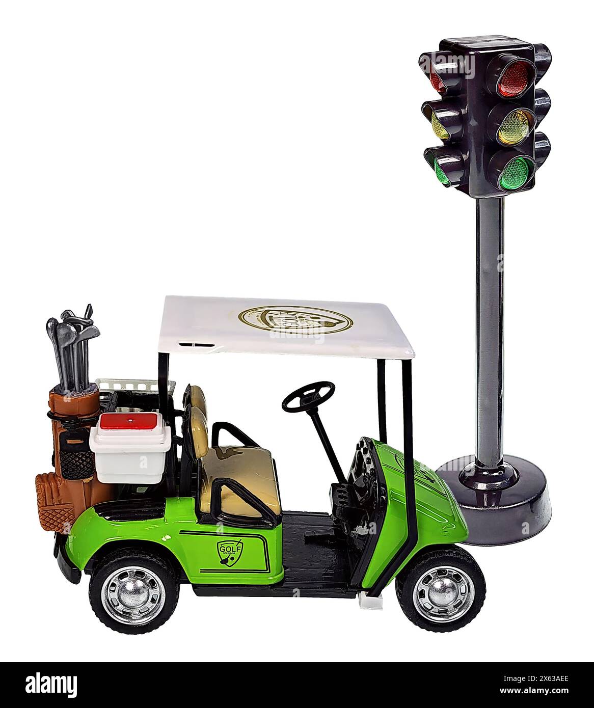 A golf cart used for transportation during a game of golf and a traffic light to show safety while playing Stock Photo