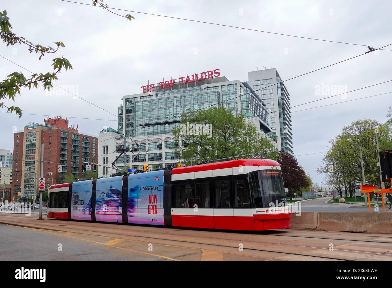 Toronto street car on Lakeshore Blvd, in front of the Tip Top Tailors
