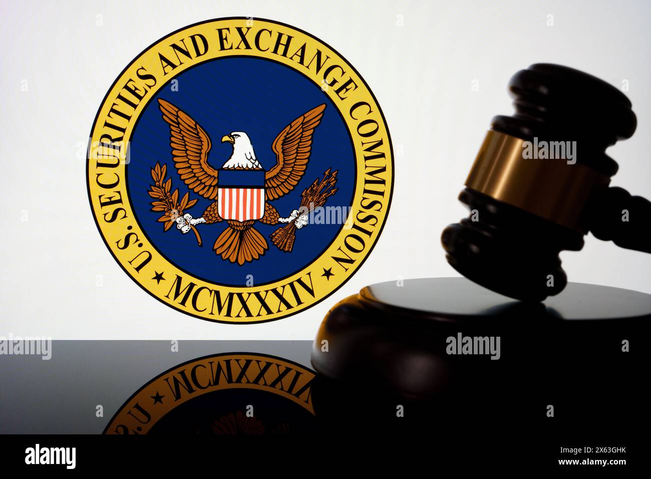US Securities and Exchange Commission SEC logo seen on the screen and judges gavel next to it. Concept for lawsuit and litigation. Stafford, United Ki Stock Photo